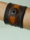 Hand made 100 per cent leather cuffs.